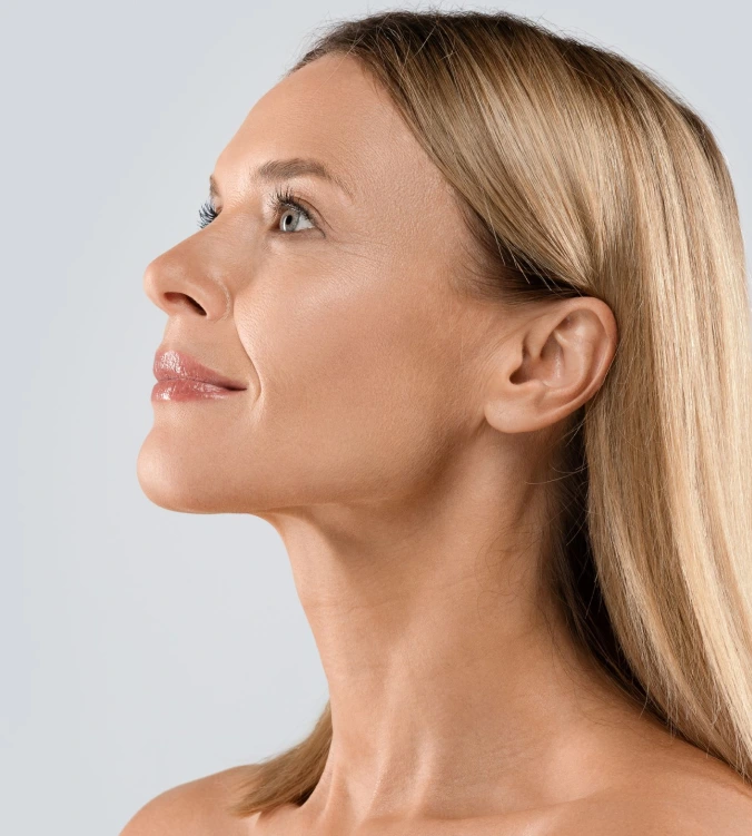 Woman in profile showing facial contour and skin texture
